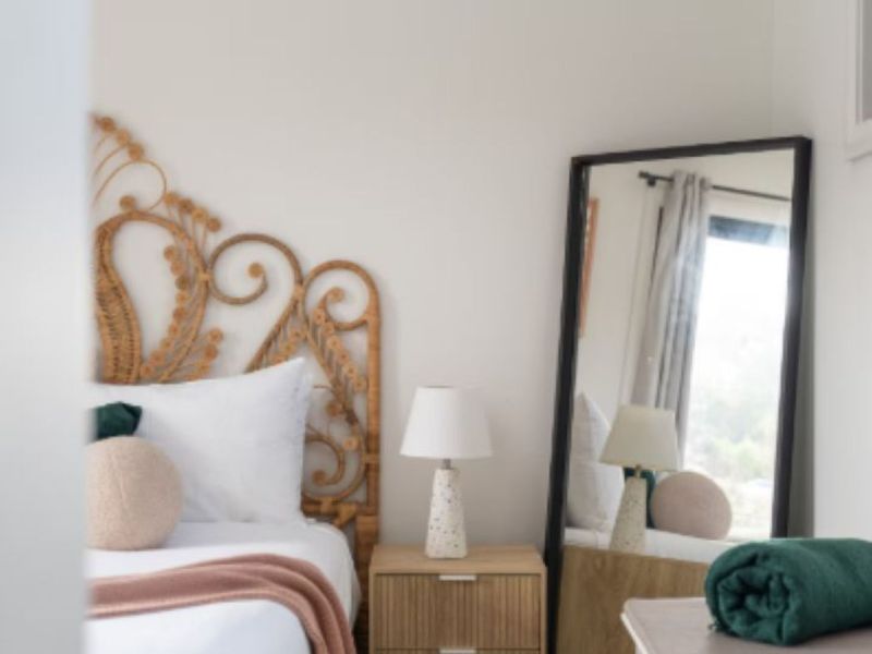 Bedroom detail with rattan-style décor