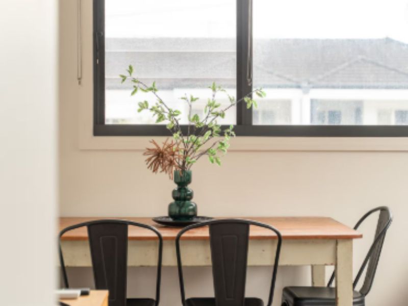 Compact desk nook with fresh flowers