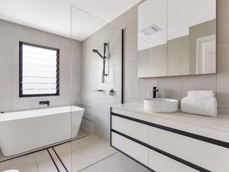 Modern bathroom with sleek vanity and window view