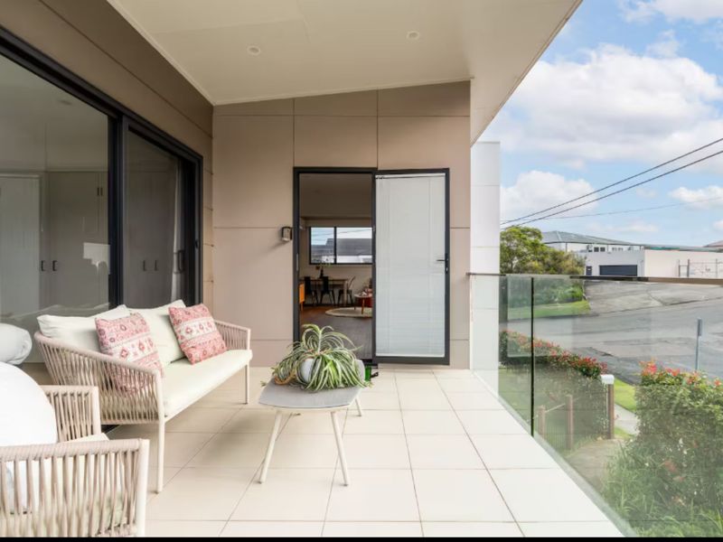 Covered balcony offering leafy suburban views