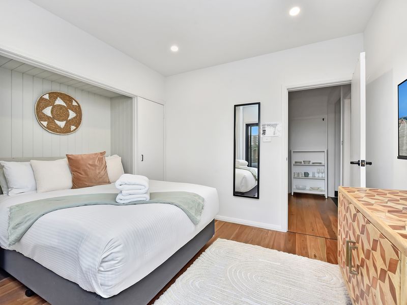 Cozy bedroom with soft linens and natural light