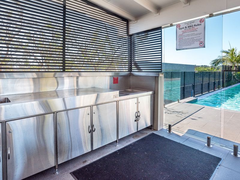 Outdoor BBQ area beside the pool, perfect for entertaining.