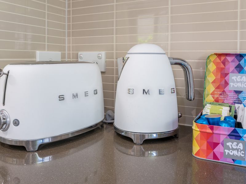 Kitchen appliances including SMEG toaster and kettle.