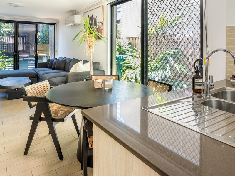 Dining area with garden views and direct access to the patio.