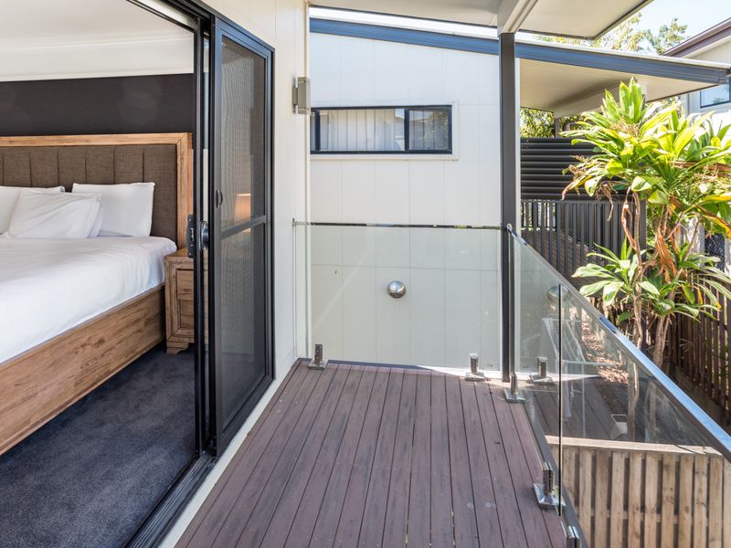Balcony off the bedroom with outdoor view.