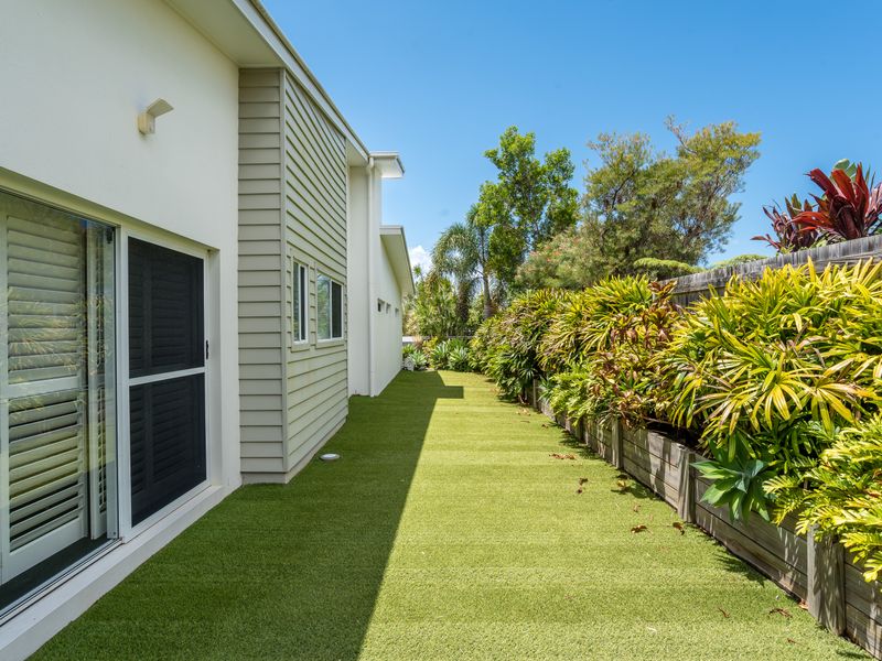 Lush green backyard perfect for outdoor play or quiet moments.