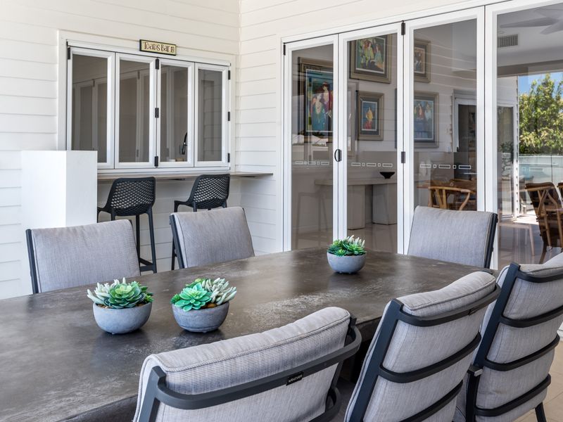 Covered patio area ideal for alfresco dining.