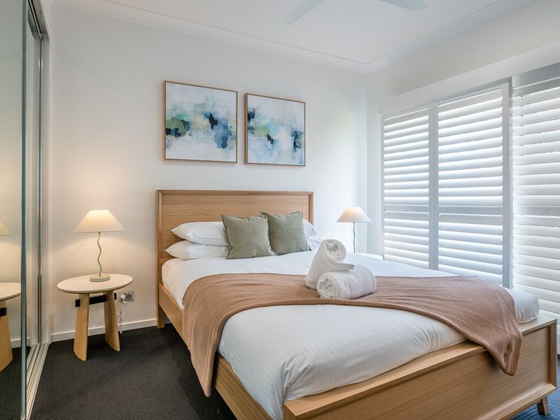 Peaceful guest bedroom with ocean-inspired decor.