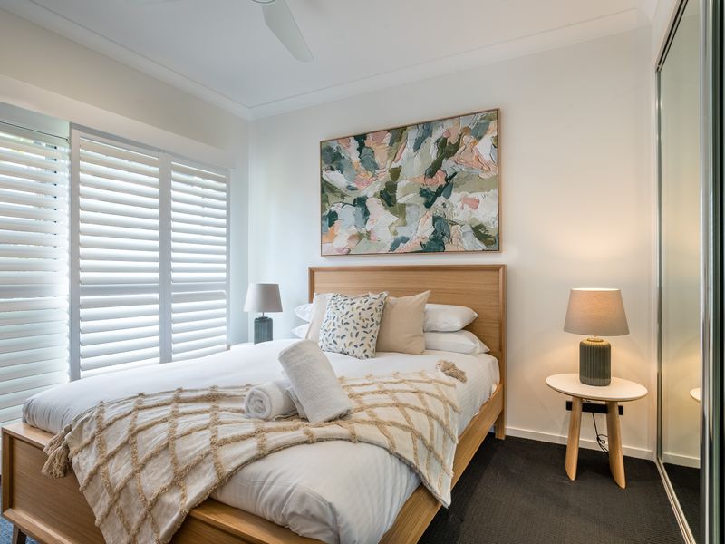 Bright twin bedroom with natural light.