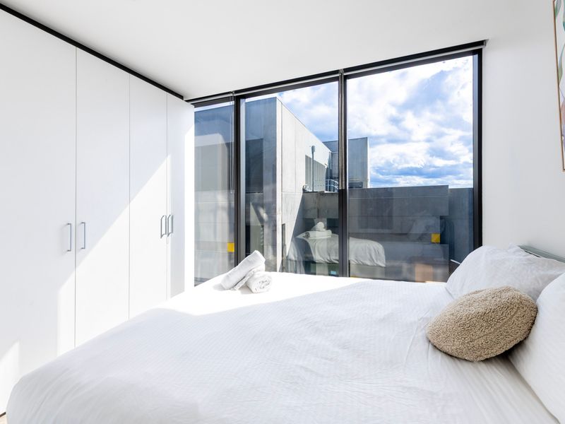 Peaceful sleeping area with floor-to-ceiling windows