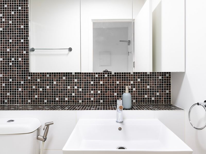 Stylish vanity area with mosaic tile detailing