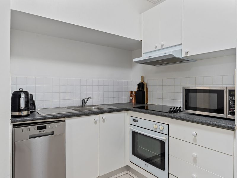 Fully equipped kitchen featuring oven, stove, and dishwasher