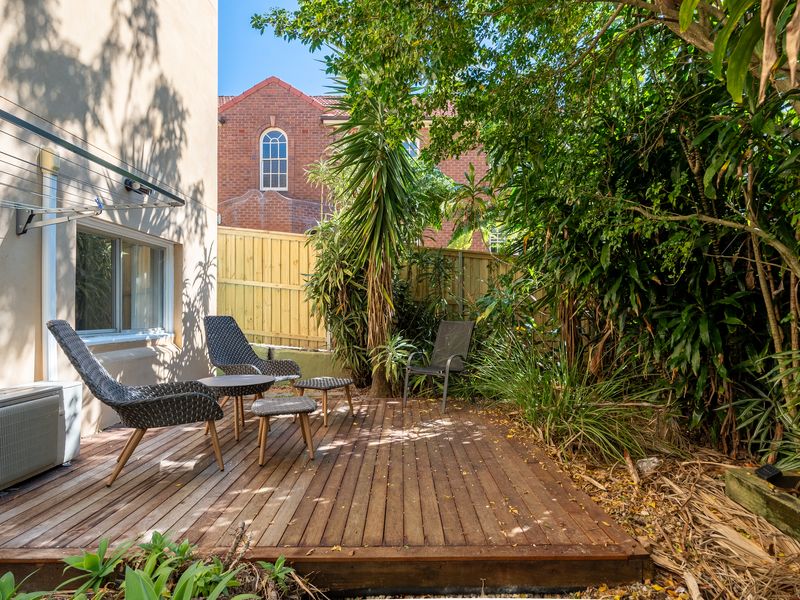 Private courtyard with comfortable seating and natural shade
