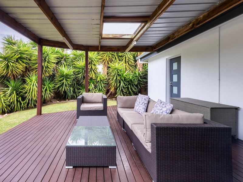 Relaxing outdoor retreat surrounded by greenery.