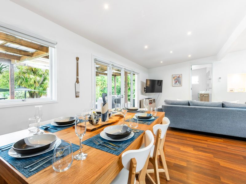 Dining area with leafy garden views.