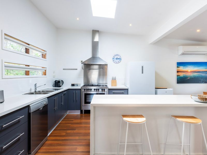 Fully equipped kitchen with breakfast bar.
