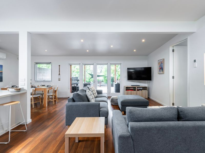Spacious living area with warm natural light.