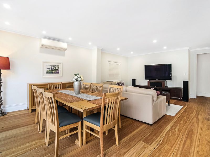 Open-plan living and dining area filled with natural light
