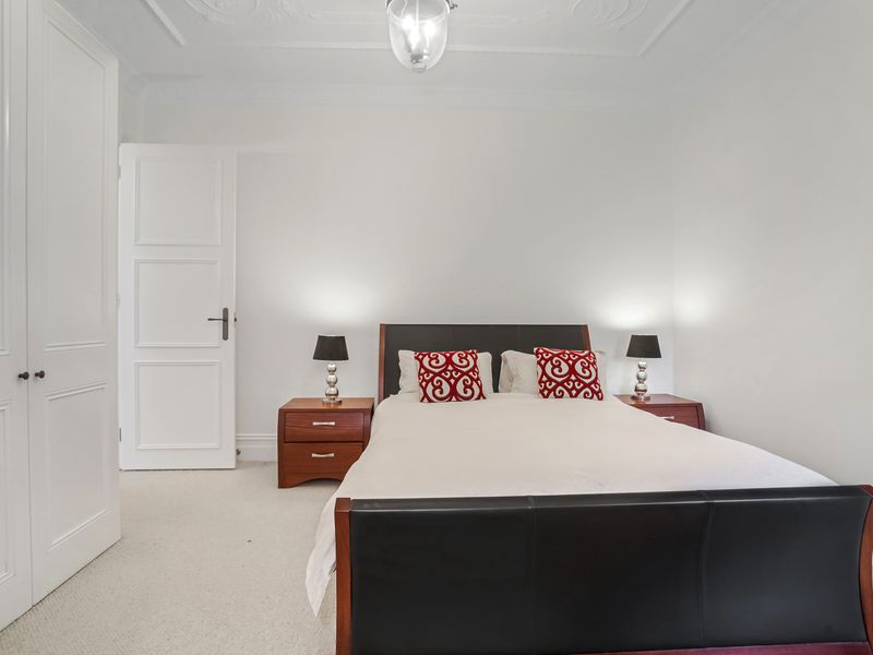 Cozy bedroom with queen bed and soft lighting