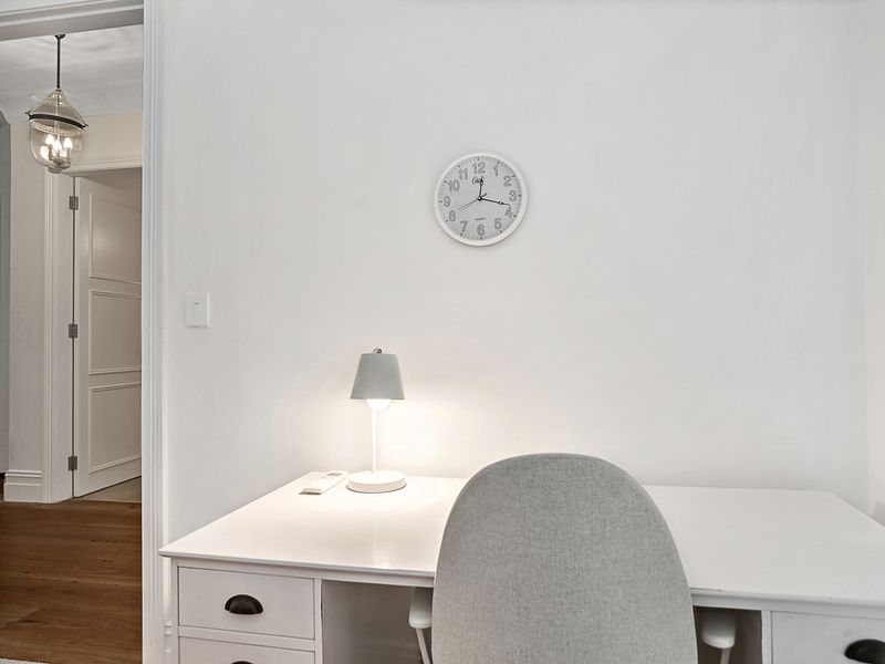 Bright study nook with desk and lamp