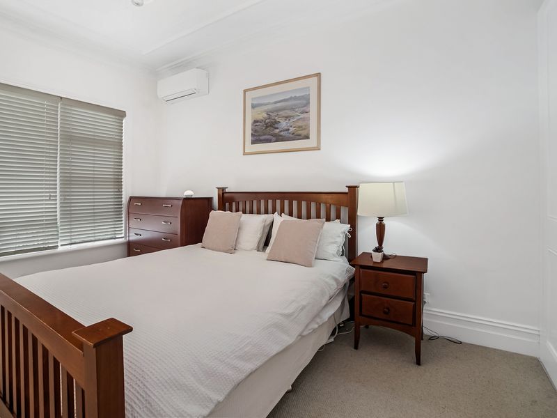 Comfortable master bedroom with warm tones