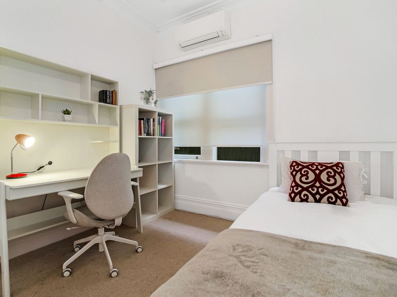 Study nook with desk, shelves, and natural light