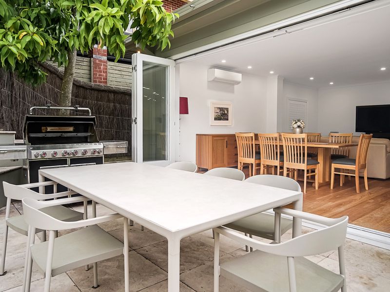 Outdoor dining area with BBQ, perfect for entertaining