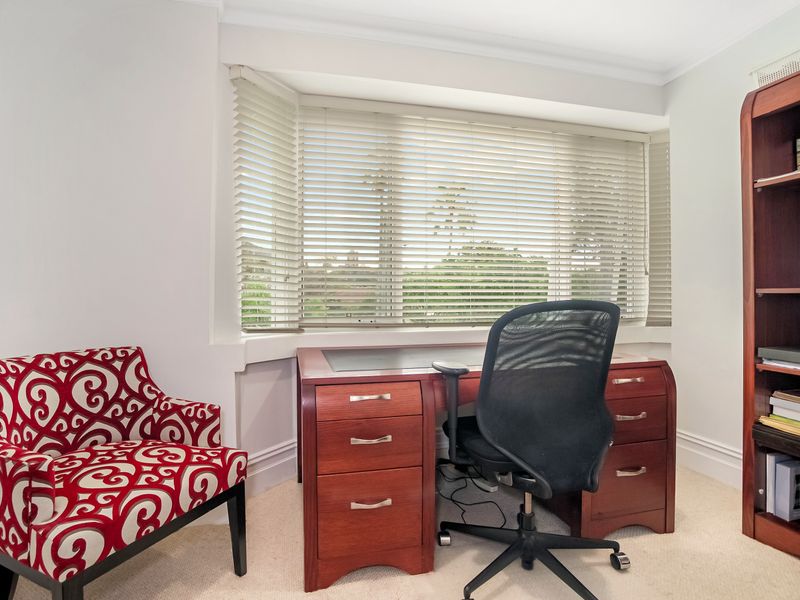 Quiet home office with desk and bookcase