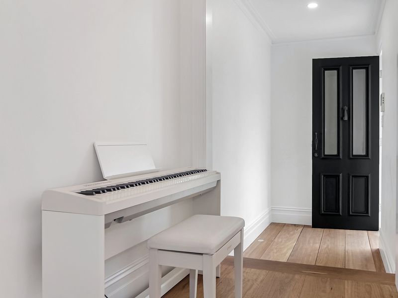 Piano nook adding a touch of charm and creativity