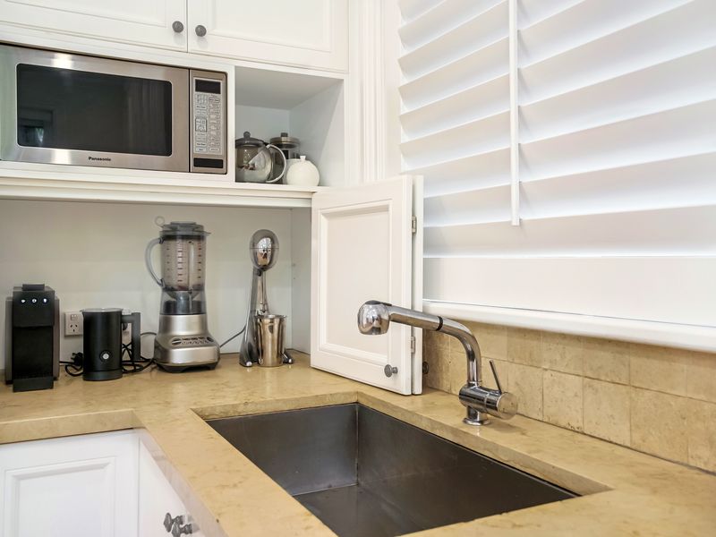 Compact kitchenette with coffee machine and essentials