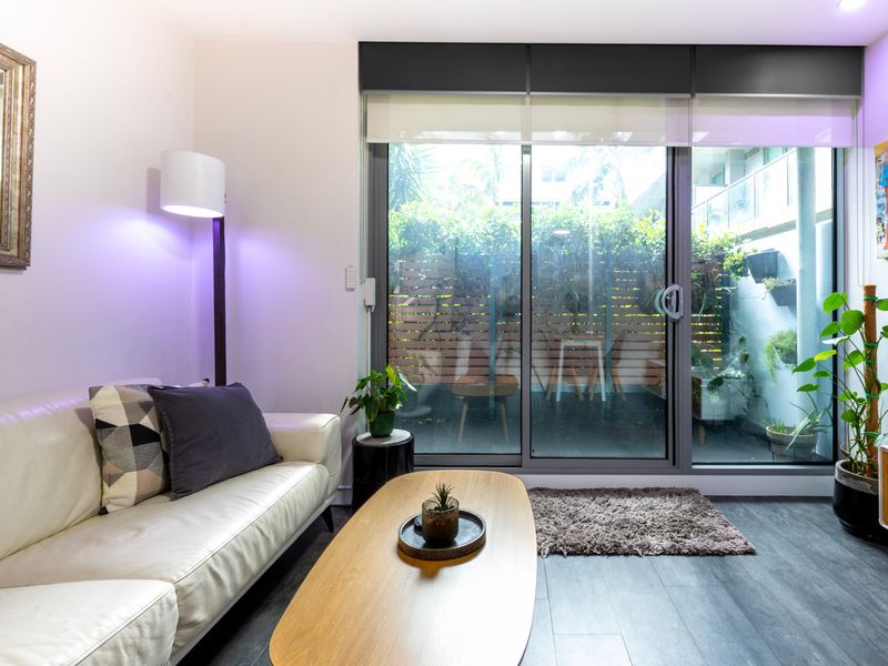 Inviting lounge with access to the outdoor space — ideal for relaxation.”