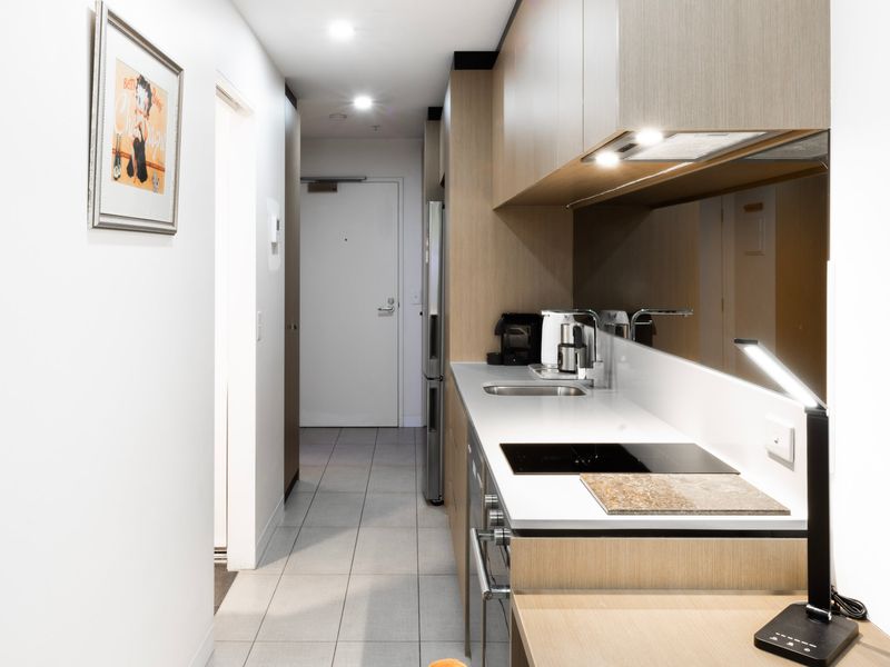 Fully equipped kitchen with sleek appliances and modern finishes.