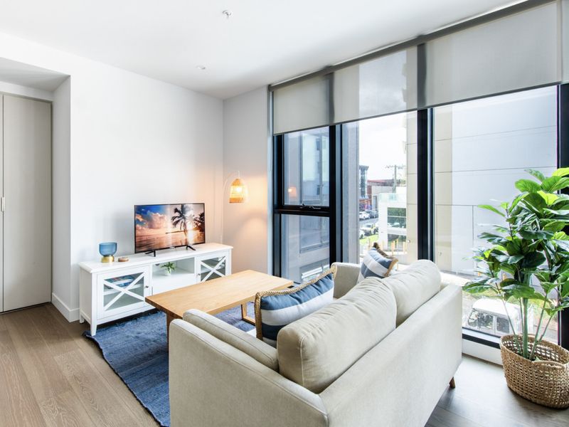 Cozy lounge space with natural light and city views.