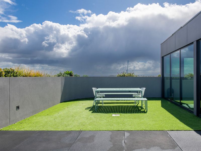 Open-air space with greenery and seating for outdoor enjoyment.