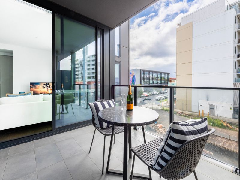 Outdoor seating area on the balcony for morning coffee or evening drinks.