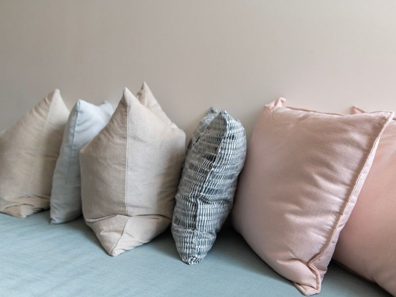 Soft accent pillows add a touch of comfort and colour to the seating area.