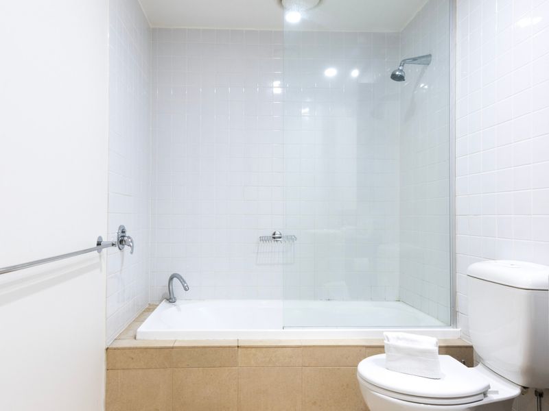 Clean and well-maintained bathroom with a relaxing bathtub.