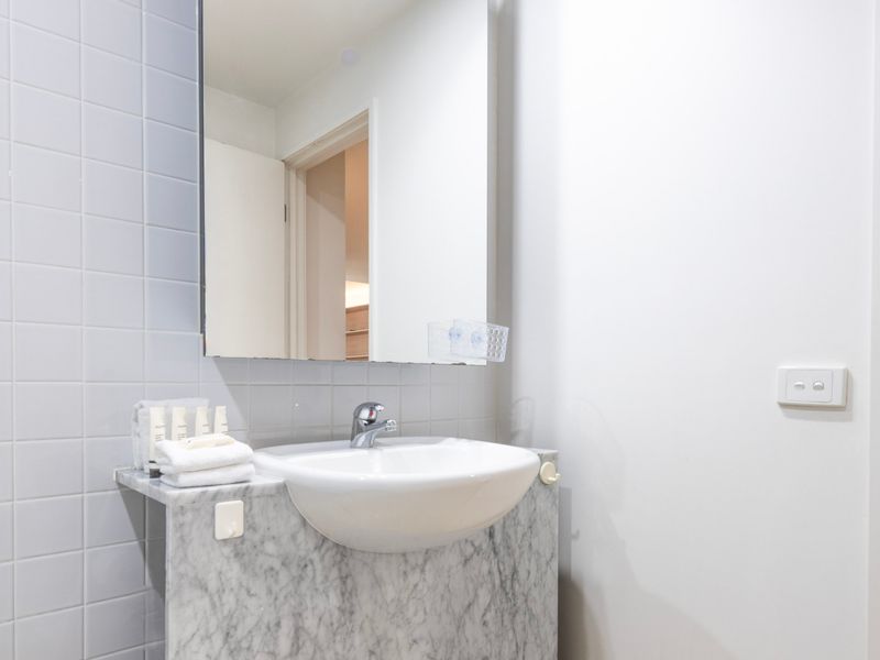 Compact bathroom with all essentials for your stay.