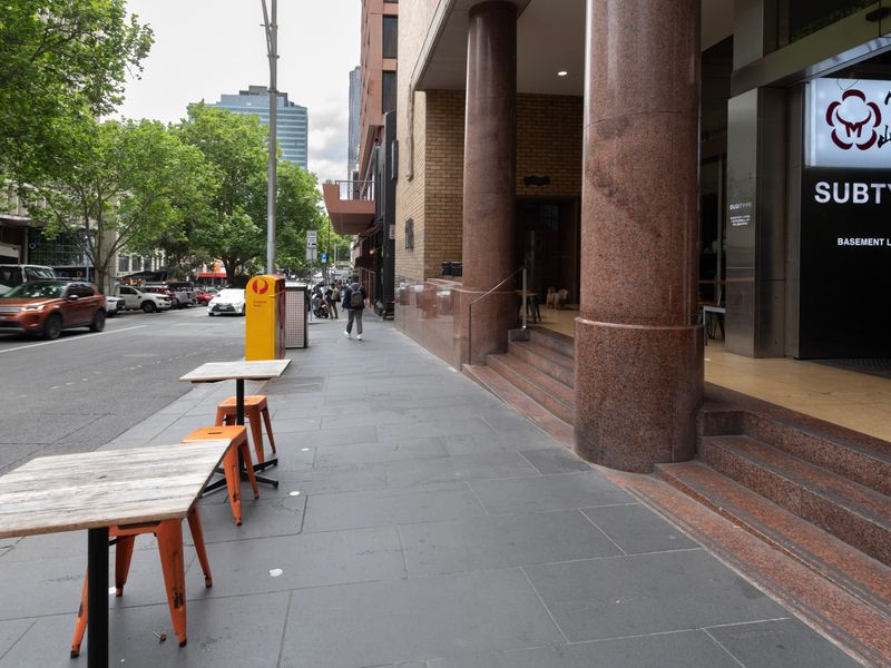 Bustling Prahran streets lined with trendy eateries and boutique stores, just moments away.