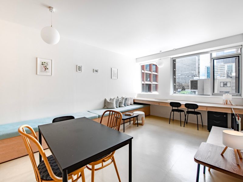 Bright and open living space with large windows and minimalist décor.