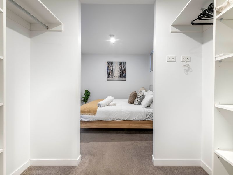 Spacious walk-in wardrobe with ample storage.