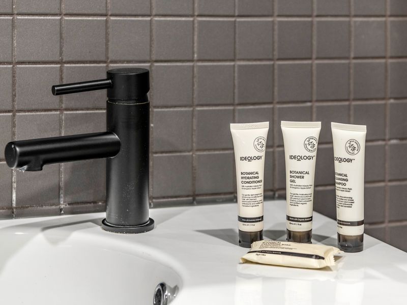 Designer vanity with high-end tapware and curated amenities