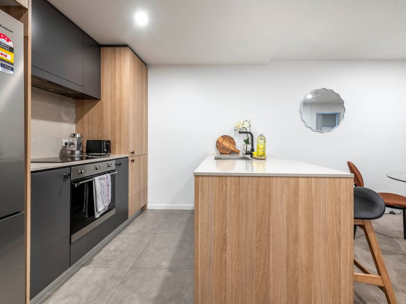 Fully equipped kitchen with stainless-steel appliances.