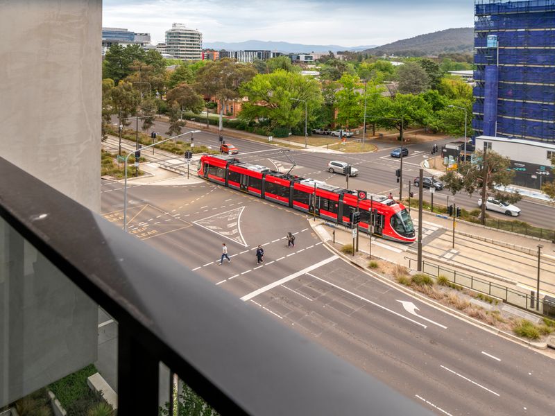 Balcony overlooking the light rail and vibrant neighborhood streets