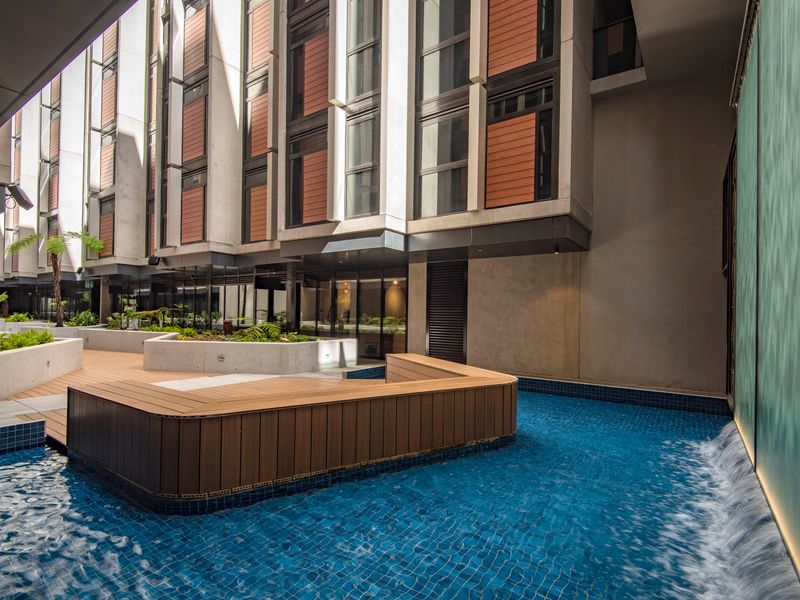 Outdoor pool area with sun loungers for unwinding in style