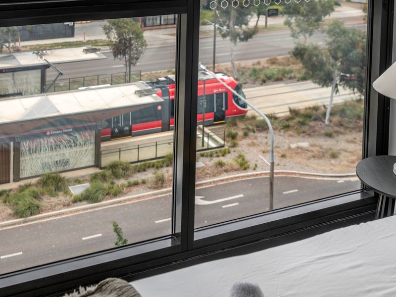 Large windows offering scenic views of the surrounding neighborhood