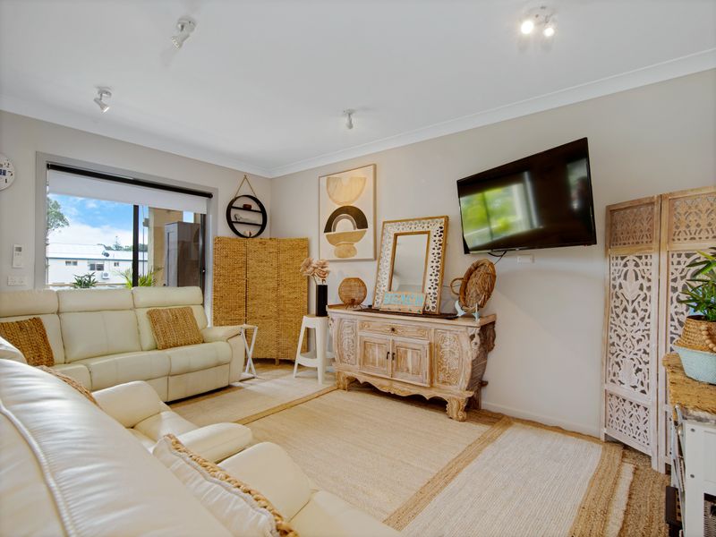 Bright living area with comfortable seating and natural light.