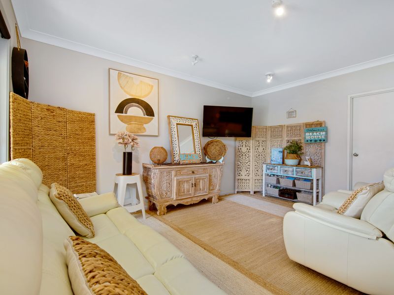 Spacious lounge area featuring natural textures and neutral tones.