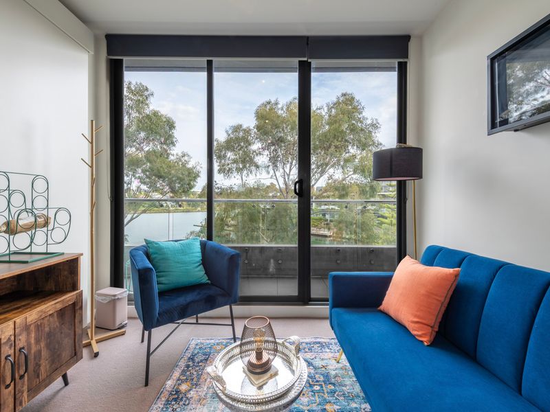 Stylish living space blending comfort, light, and natural scenery.