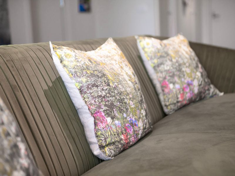 Soft, stylish cushions add a cozy touch to the living area — ideal for a quiet night in.